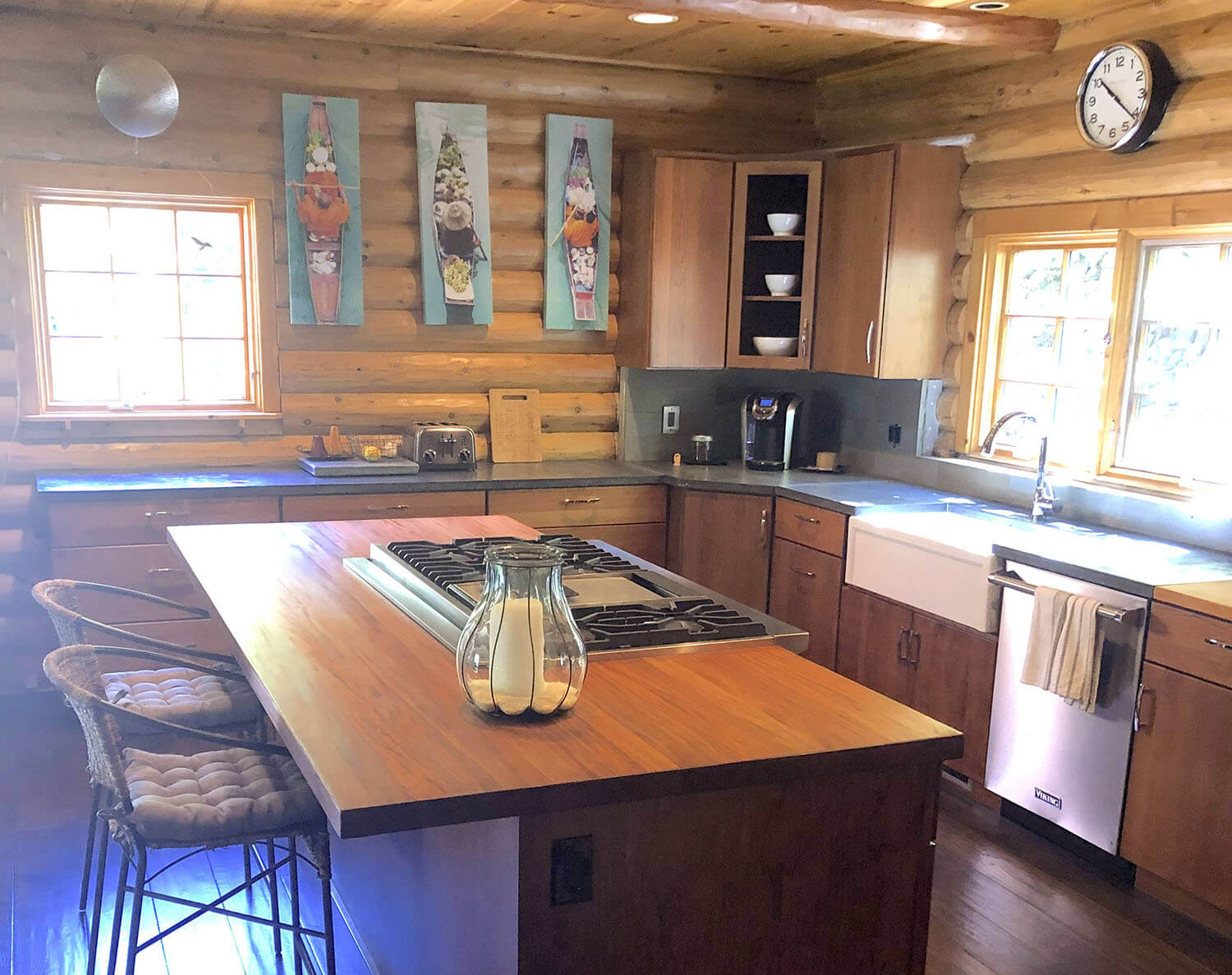 Rustic country log cabin kitchen with wood island
