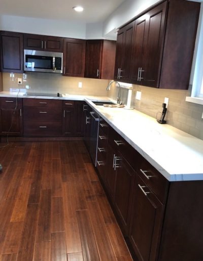 dark cabinets with light countertops
