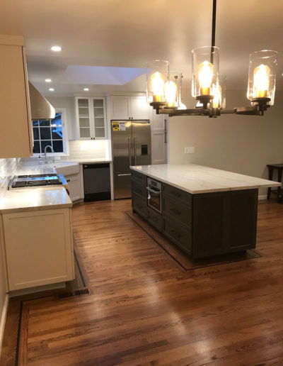 dark island, white cabinets, built-in microwave - kitchen remodel in Bay Area