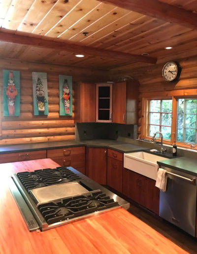 large stove top in island - log cabin kitchen remodel