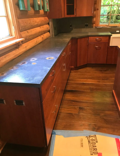 unique countertops in log cabin kitchen