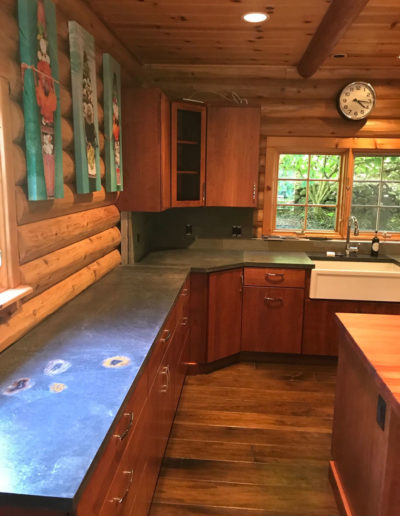custom countertops in modernized log cabin kitchen
