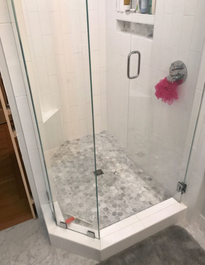 glass shower with white tile
