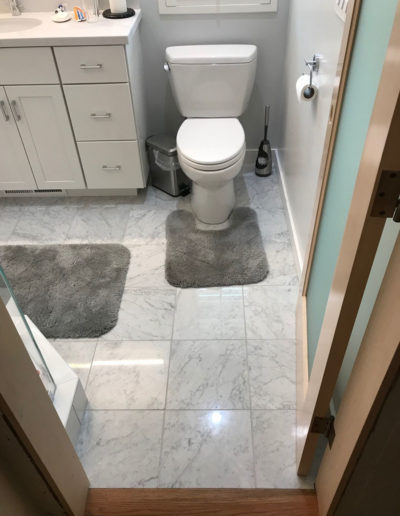 white bathroom with grey and white tile