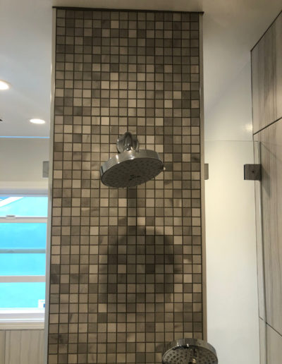 new showerhead installed in bathroom remodel